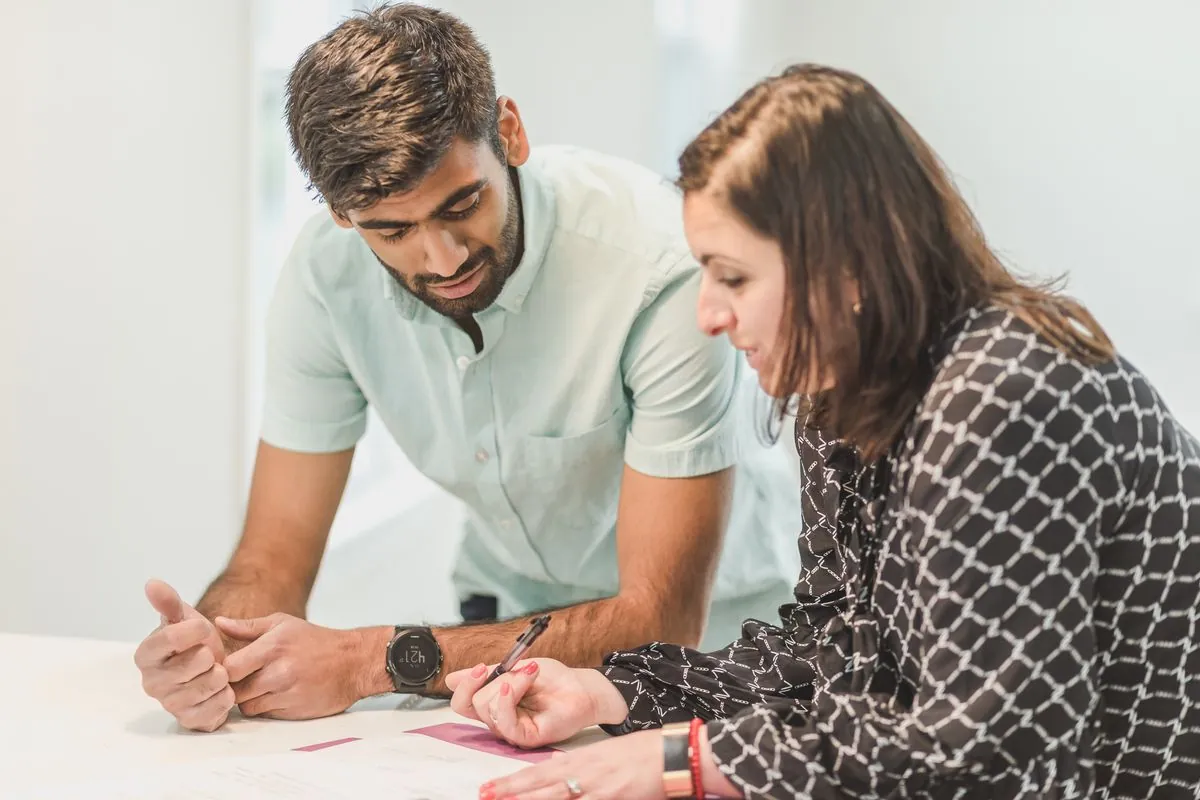 A person getting help to review important housing documents