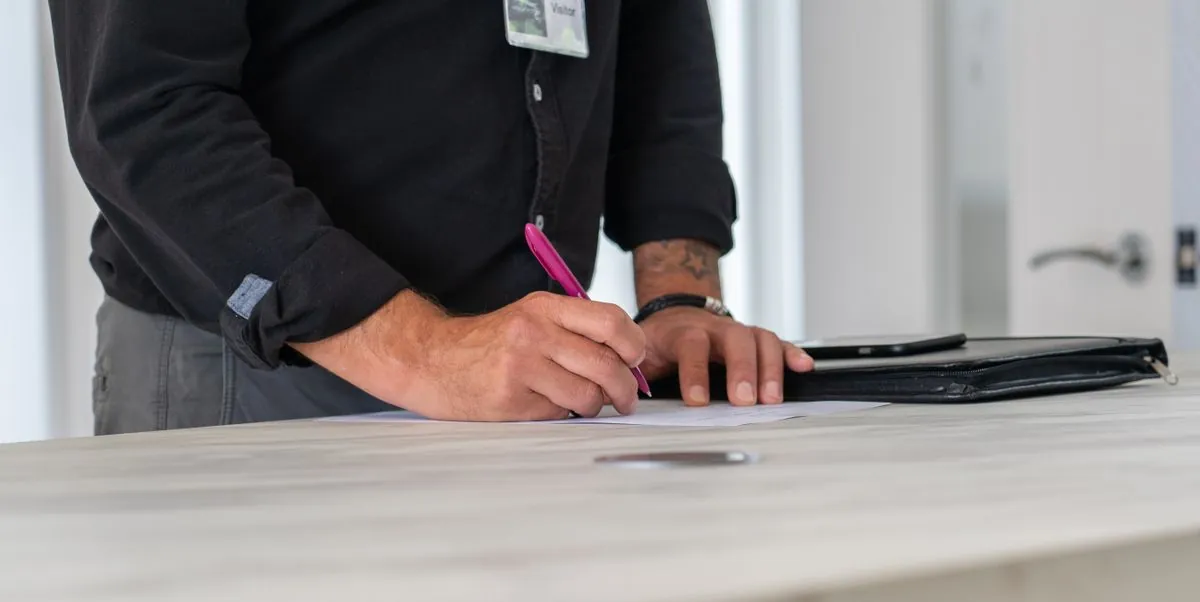 A property professional reviewing documents at a desk