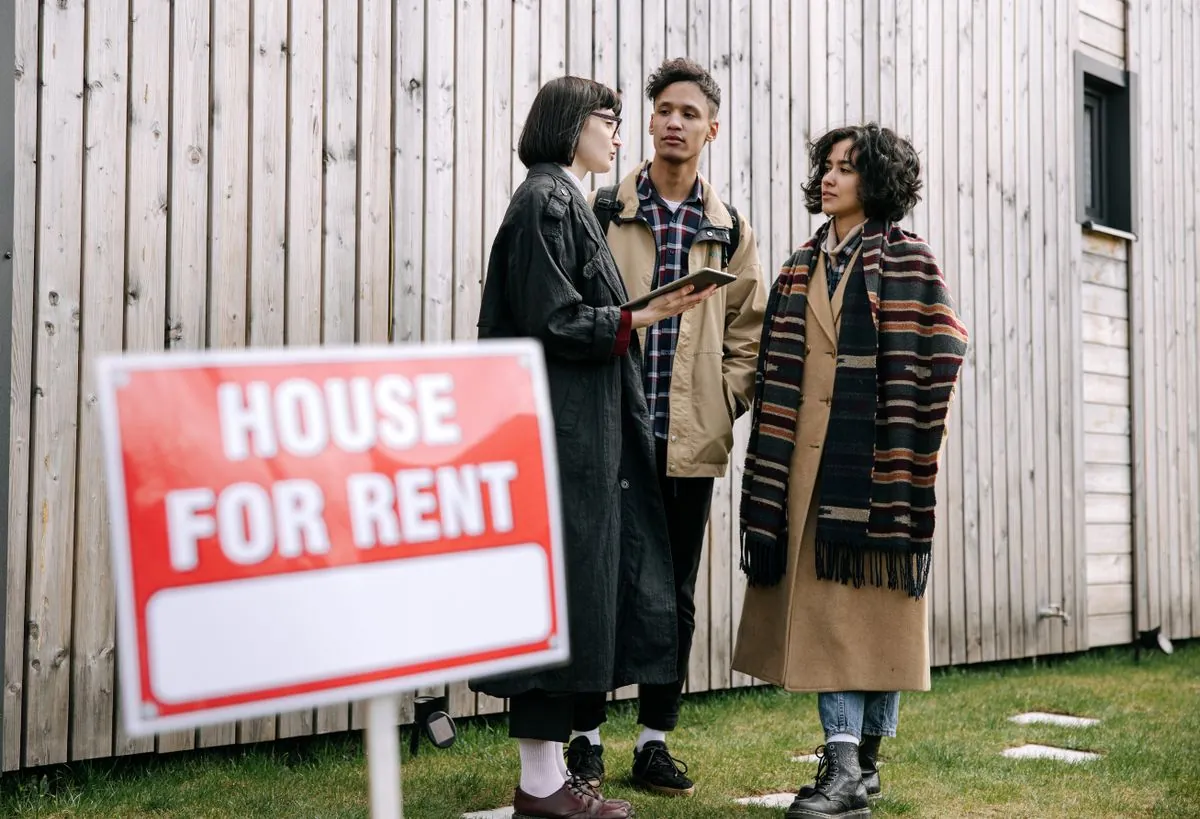 Prospective renters discussing a home with an agent