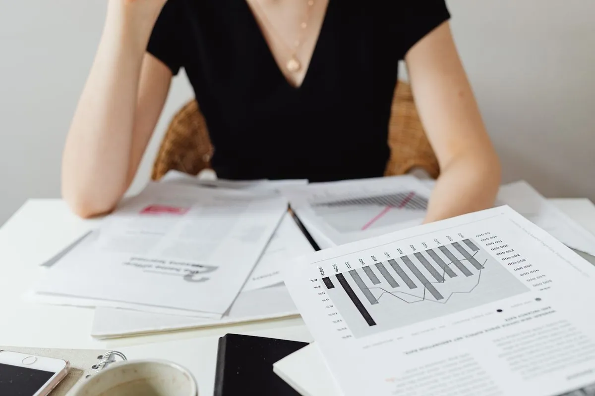 Financial records and charts arranged on an office desk