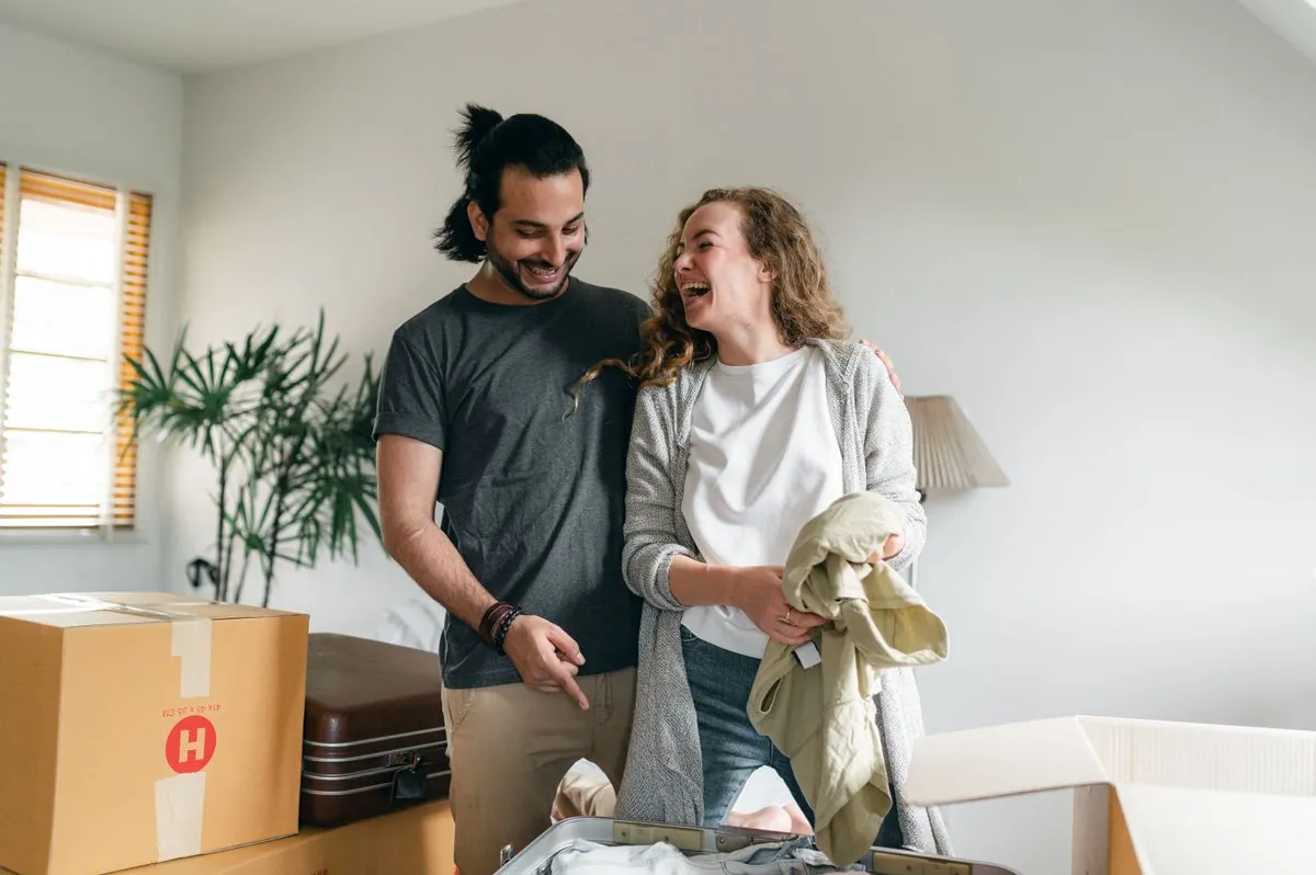 A couple unpacking boxes in their new home