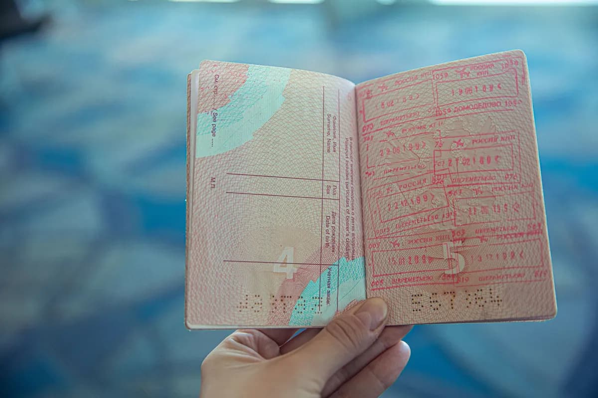 An open passport held ready for an identity check