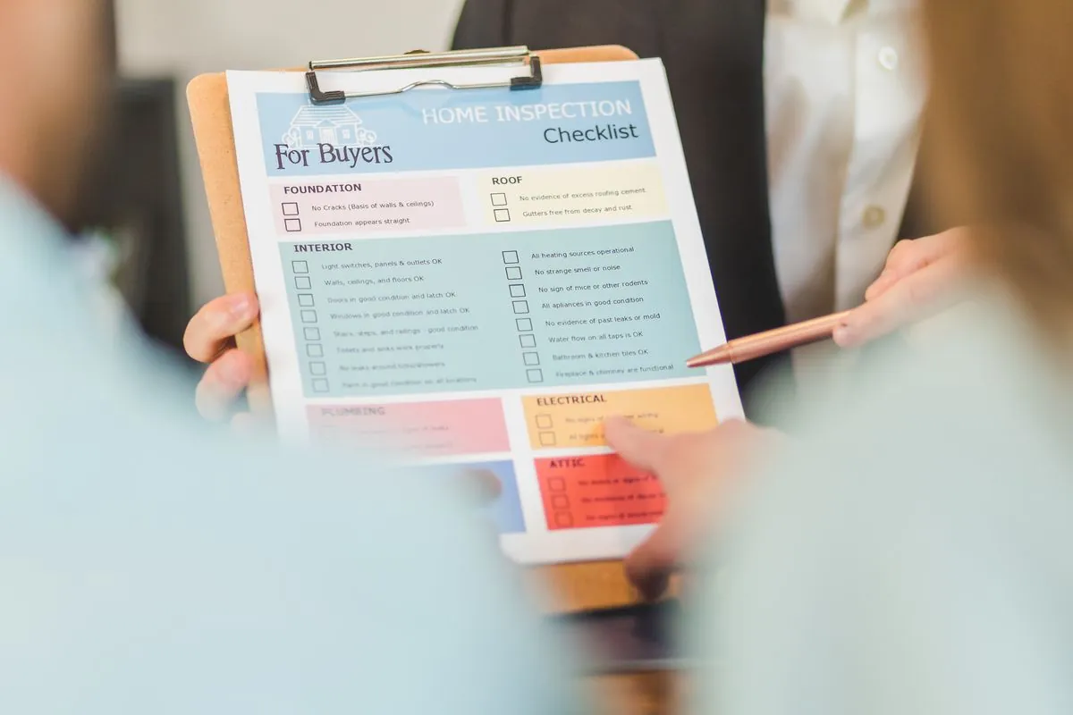 A home inspection checklist held on a clipboard