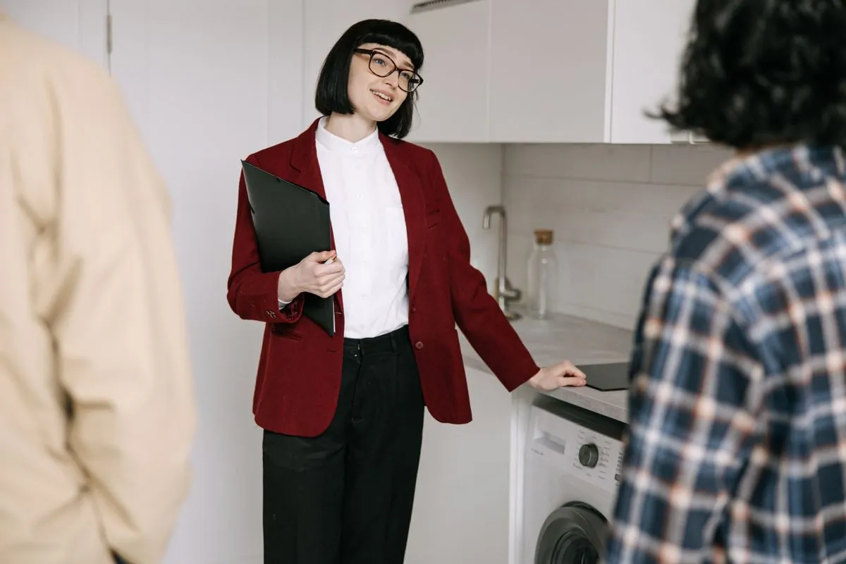 An agent answering questions during an apartment viewing