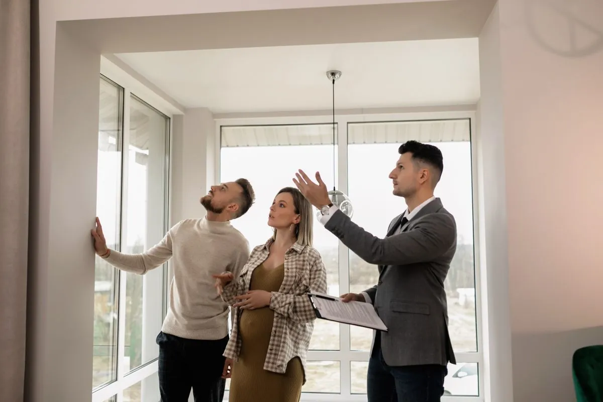 Prospective renters viewing rooms with an agent